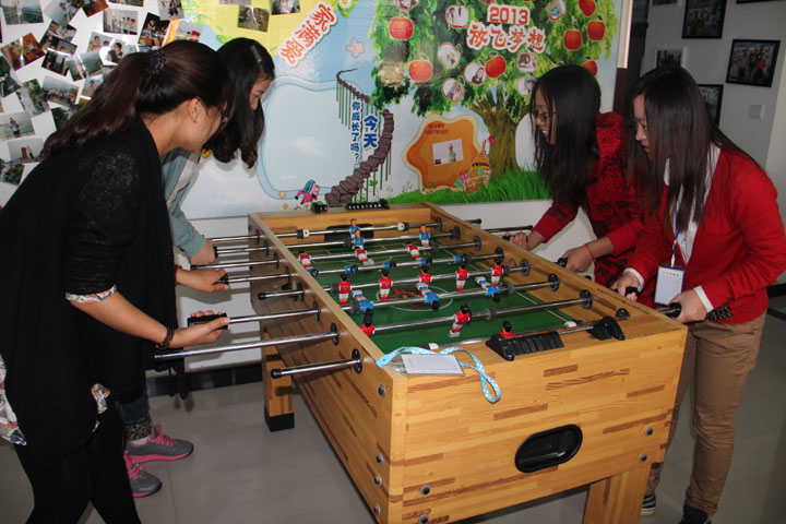 We playing foosball in the spare time welcome you join us